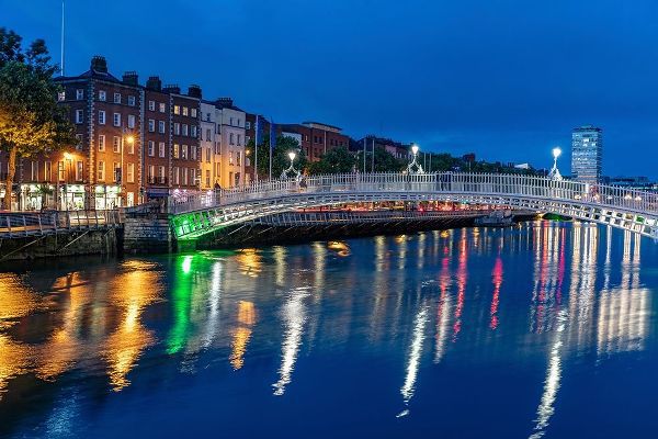 Ha Penny Bridge over the River Liffey at dusk in downtown Dublin-Ireland
